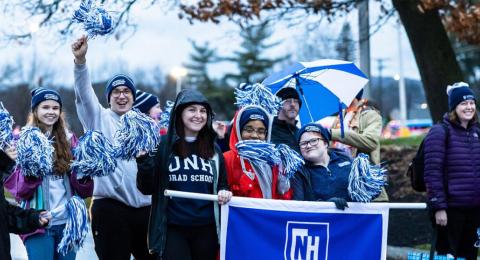 Front line of a festive holiday parade at UNH