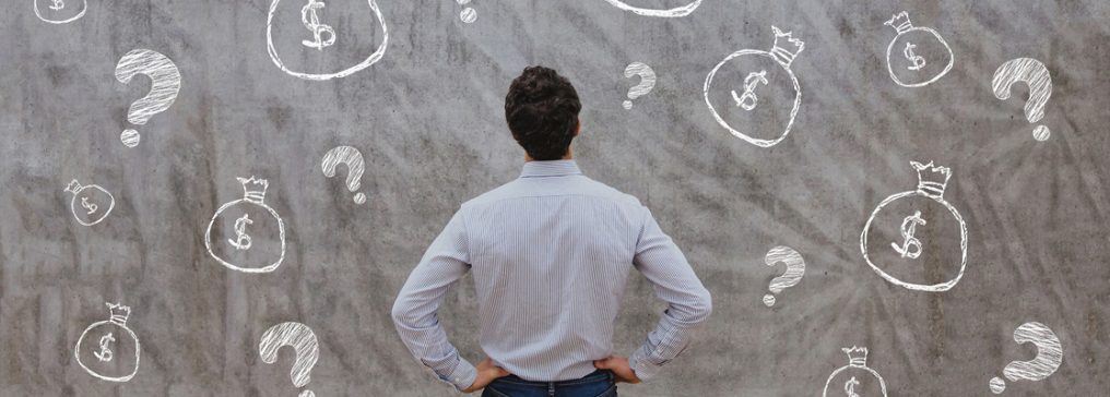 image of a man looking at a chalk board with drawings of question marks and dollar signs