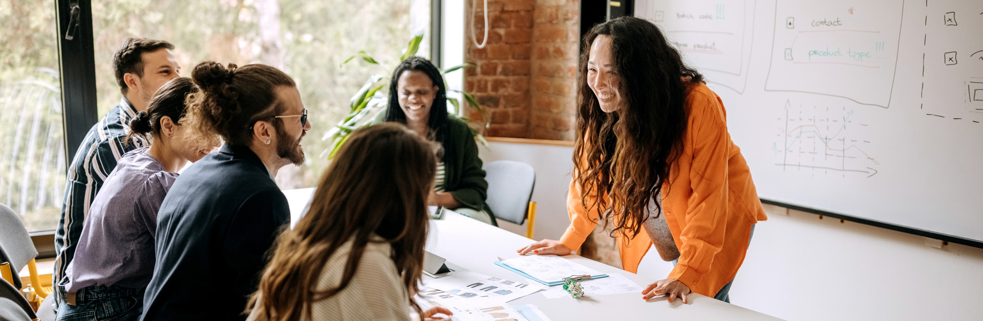 a group of people sitting around a conference table