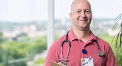 Health Care professional with pink shirt and stethoscope