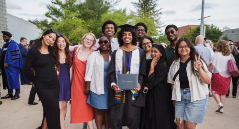 diverse group of students outside at graduation