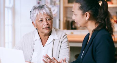 an older woman speaking to a mental health advocate.