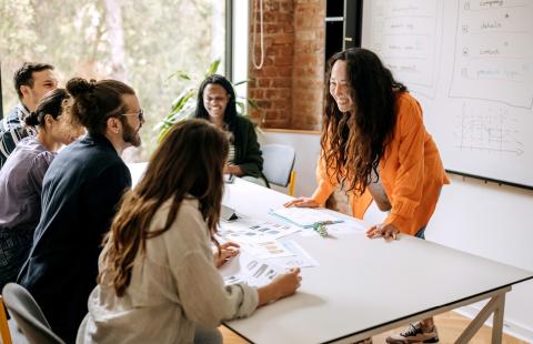 group of people sitting around a conference table