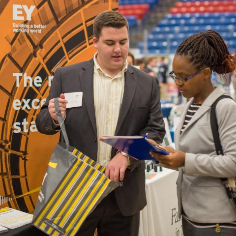 Student speaking with employer at a career fair