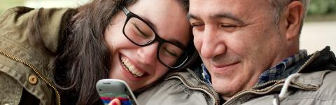 Father and Daughter looking at phone