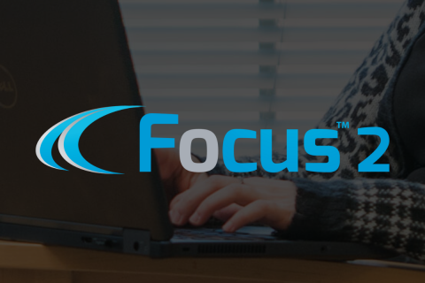 Focus 2 logo on top of an image showing hands on a keyboard