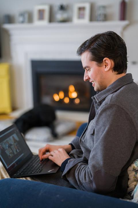 Graduate Student on his laptop at home