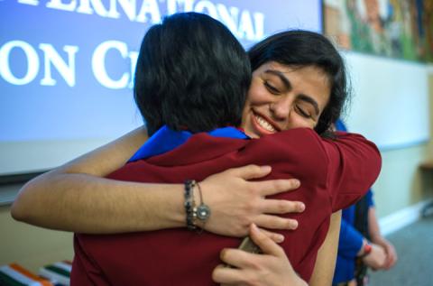 International Student hugging 