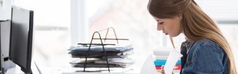 Woman looking through paperwork