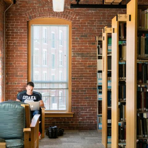 Student working in a UNH library