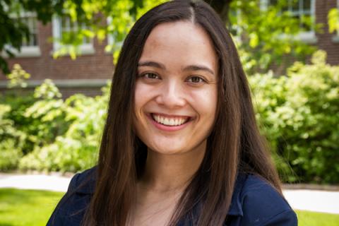Smiling woman wearing a blazer outside