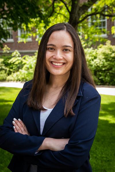 Photo of Madison in front of a tree at the UNH campus