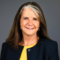 headshot of a middle aged brunette woman
